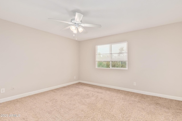 spare room featuring carpet floors and ceiling fan