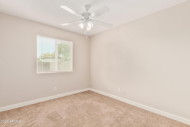 empty room featuring ceiling fan and carpet floors