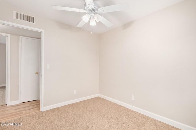 unfurnished bedroom with light carpet and ceiling fan