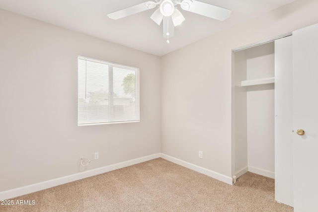 unfurnished bedroom with ceiling fan and light carpet