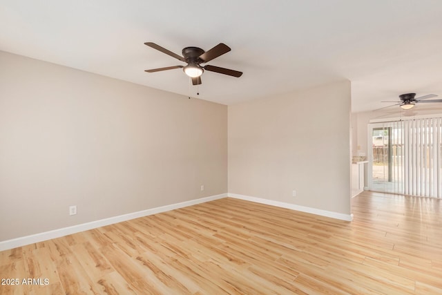 spare room with ceiling fan and light hardwood / wood-style floors