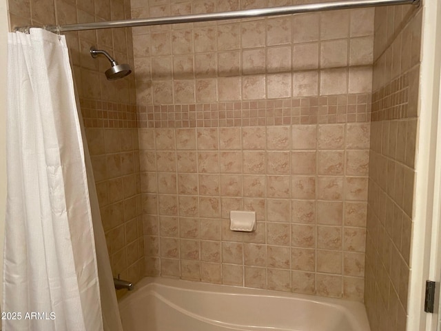 bathroom featuring shower / bath combo with shower curtain