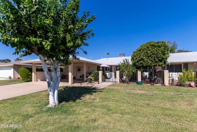 view of front facade with a garage and a front lawn