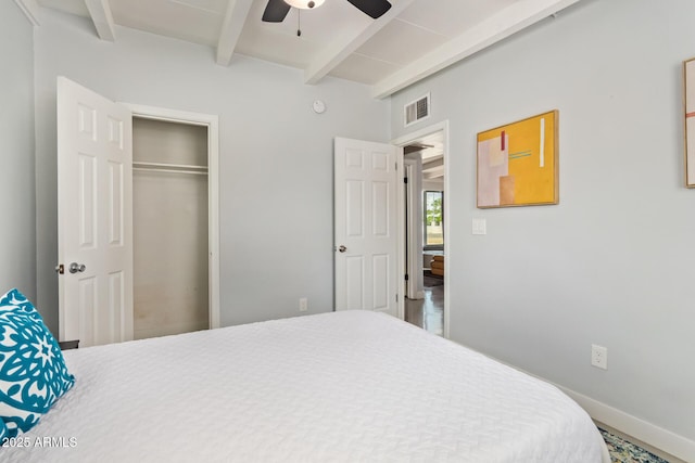 2205 W Cambridge Ave, Phoenix, AZ 85009 - bedroom featuring beam ceiling, baseboards, a ceiling fan, and a closet