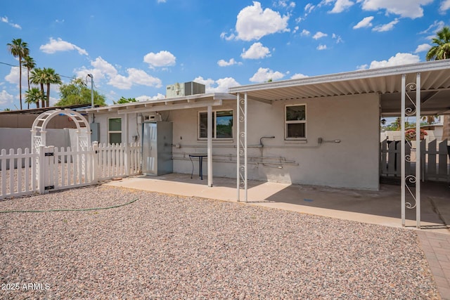 2205 W Cambridge Ave, Phoenix, AZ 85009 - rear view of property with stucco siding, a patio area, and a gate