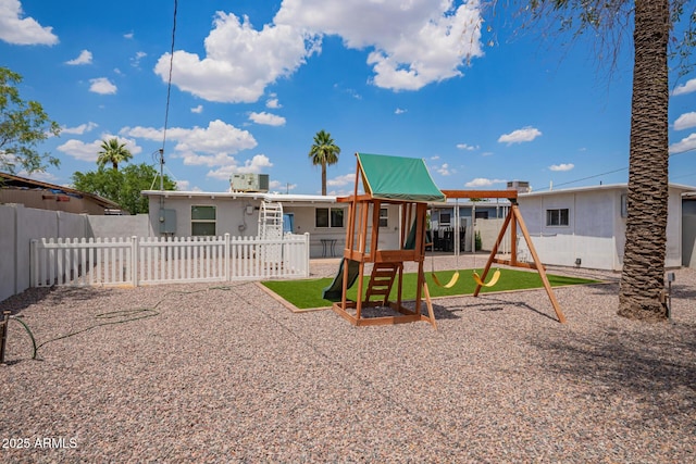 2205 W Cambridge Ave, Phoenix, AZ 85009 - back of house with a playground and cooling unit