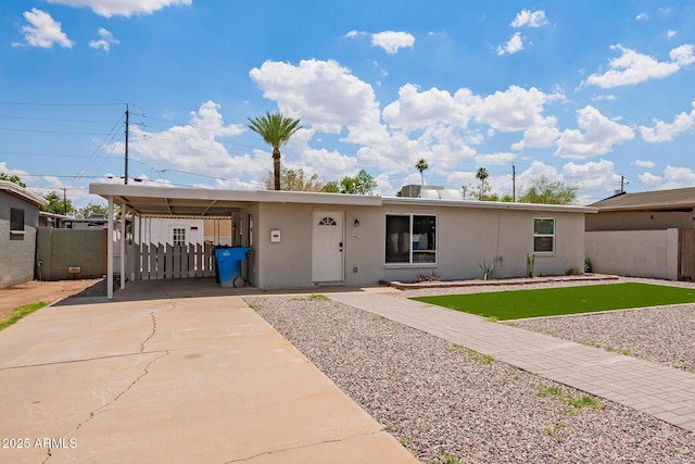 2205 W Cambridge Ave, Phoenix, AZ 85009 - ranch-style home featuring stucco siding, a carport, and driveway