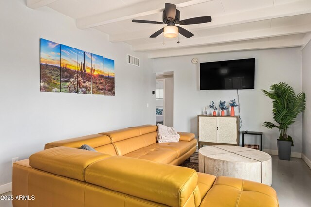 2205 W Cambridge Ave, Phoenix, AZ 85009 - living room featuring beamed ceiling, baseboards, a ceiling fan, and concrete flooring