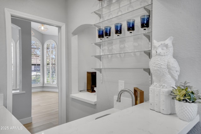 interior space featuring baseboards and wood finished floors