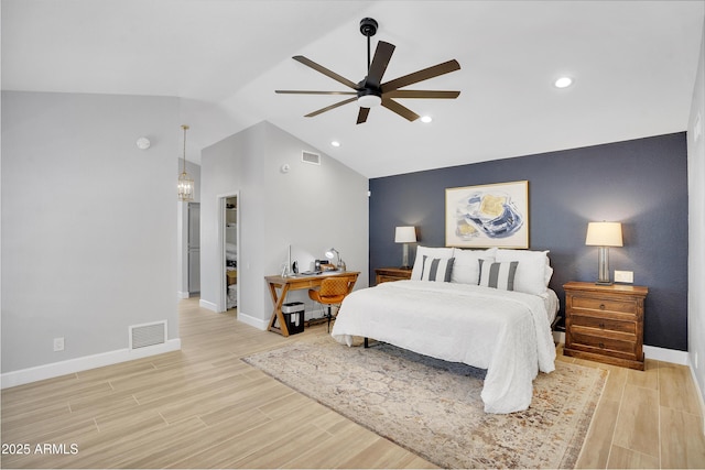 bedroom with visible vents, light wood-type flooring, baseboards, and lofted ceiling