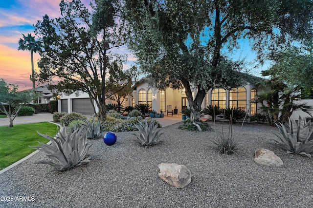 view of yard with aphalt driveway