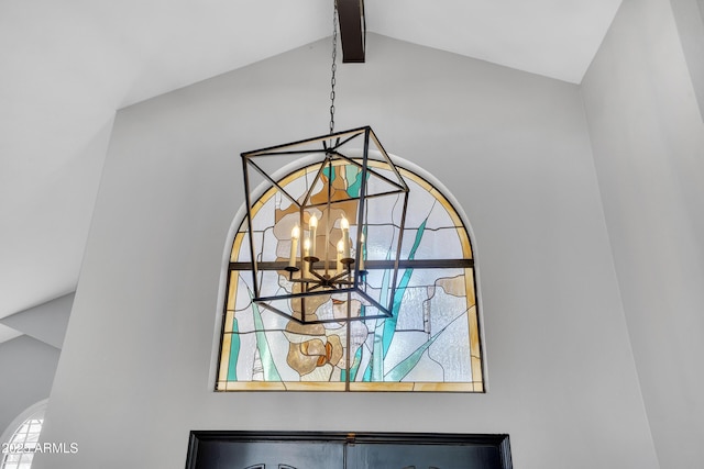 room details featuring a chandelier and beamed ceiling