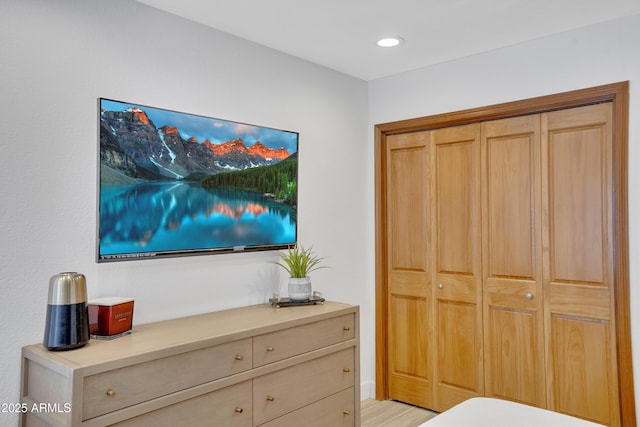 bedroom with a closet and recessed lighting