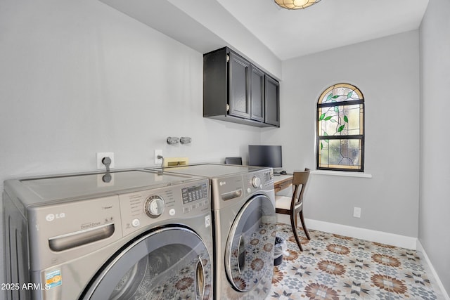 laundry room featuring cabinet space, baseboards, and washer and dryer