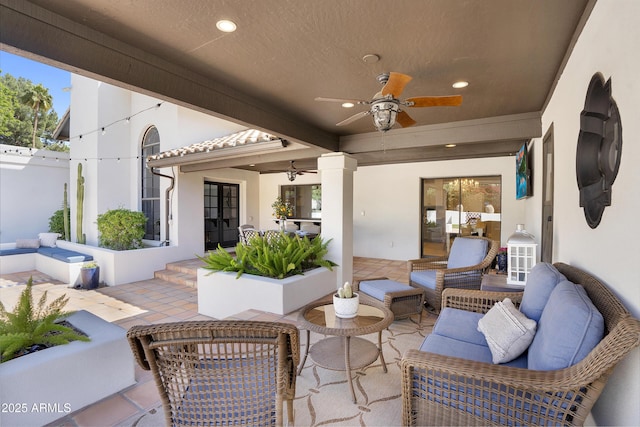 view of patio / terrace featuring french doors, outdoor lounge area, and a ceiling fan