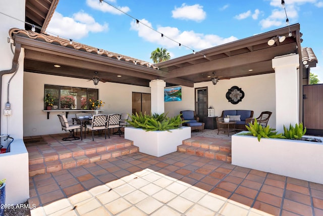 view of patio / terrace with an outdoor living space, outdoor dining space, and a ceiling fan