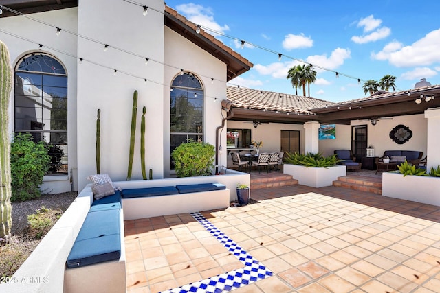 view of patio with outdoor dining space, an outdoor living space, and ceiling fan