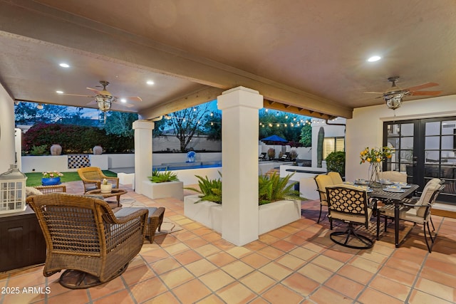 view of patio / terrace featuring outdoor dining space, french doors, an outdoor hangout area, fence, and ceiling fan
