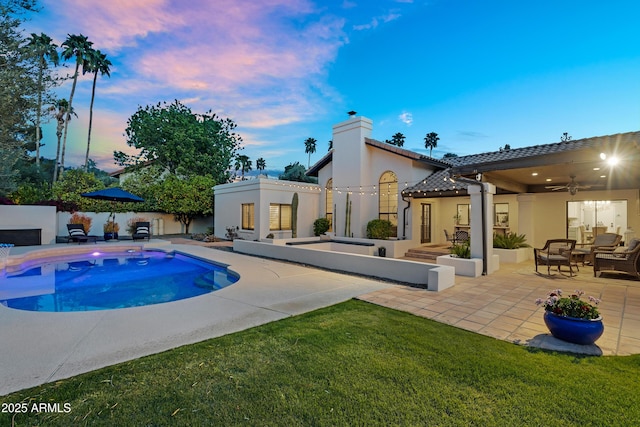 view of swimming pool with a fenced in pool, a patio, an outdoor hangout area, fence, and ceiling fan