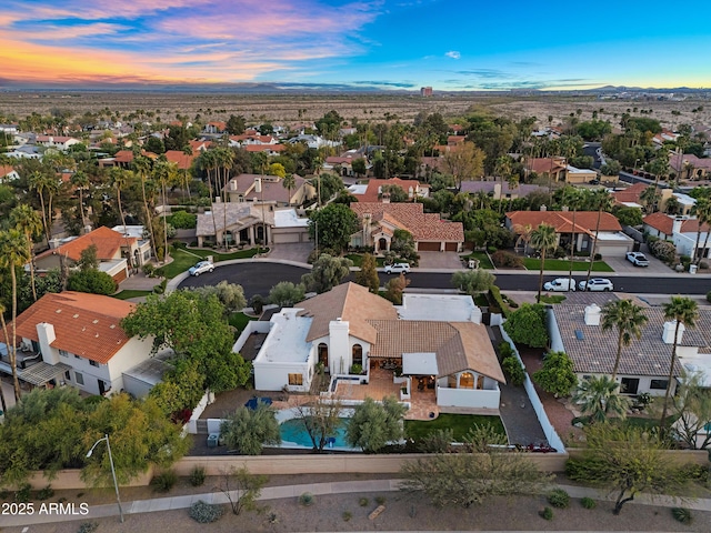 drone / aerial view featuring a mountain view and a residential view