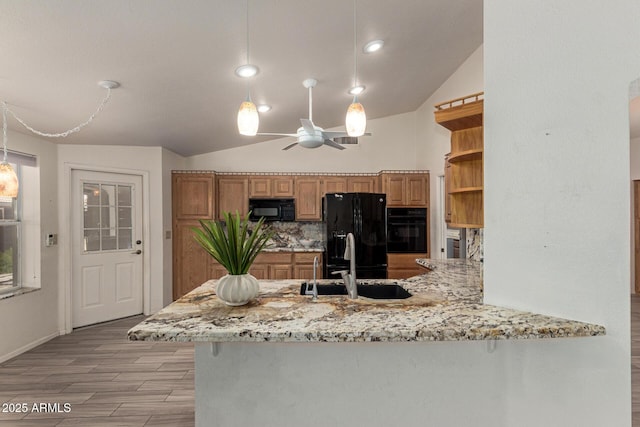 7839 E Milagro Ave, Mesa, AZ 85209 - kitchen with black appliances, open shelves, a ceiling fan, a peninsula, and light stone countertops