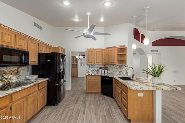 7839 E Milagro Ave, Mesa, AZ 85209 - kitchen with black appliances, a peninsula, open shelves, a ceiling fan, and decorative backsplash