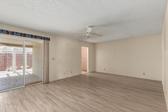 7839 E Milagro Ave, Mesa, AZ 85209 - spare room with a ceiling fan, light wood finished floors, and a textured ceiling
