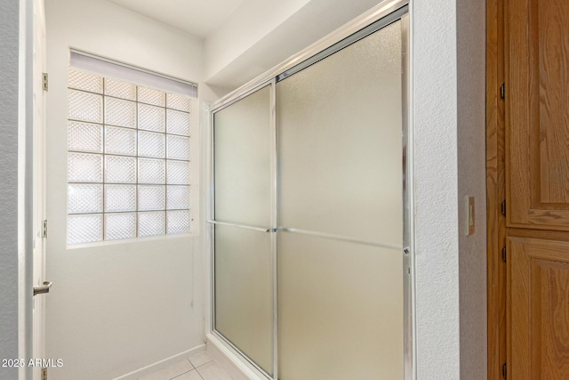 7839 E Milagro Ave, Mesa, AZ 85209 - bathroom with a shower with shower door, healthy amount of natural light, and tile patterned flooring