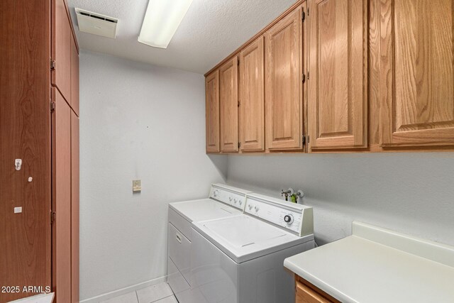 7839 E Milagro Ave, Mesa, AZ 85209 - washroom featuring cabinet space, separate washer and dryer, and light tile patterned floors