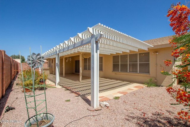 7839 E Milagro Ave, Mesa, AZ 85209 - fenced backyard with a pergola, a patio, and ceiling fan