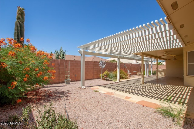 7839 E Milagro Ave, Mesa, AZ 85209 - fenced backyard with a ceiling fan, a pergola, and a patio area