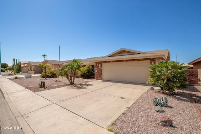 7839 E Milagro Ave, Mesa, AZ 85209 - ranch-style house featuring concrete driveway and an attached garage