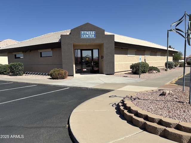 7839 E Milagro Ave, Mesa, AZ 85209 - view of building exterior featuring uncovered parking