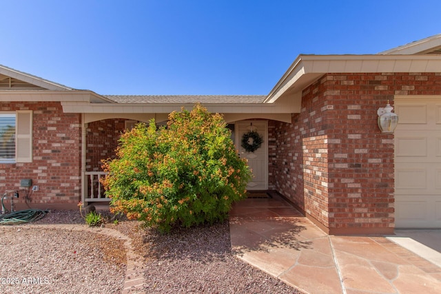 7839 E Milagro Ave, Mesa, AZ 85209 - doorway to property with brick siding and a garage