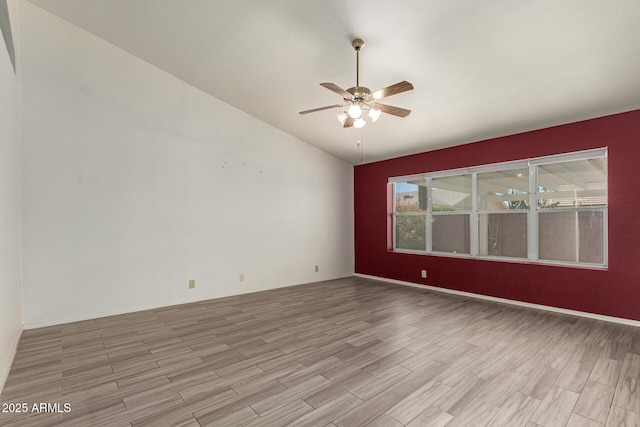7839 E Milagro Ave, Mesa, AZ 85209 - spare room with vaulted ceiling, light wood-style floors, and a ceiling fan