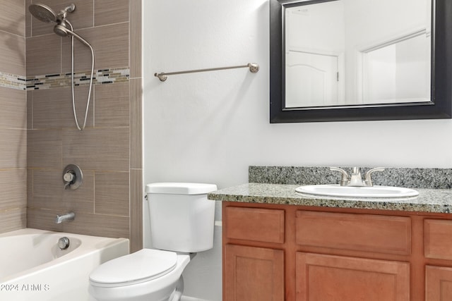 full bathroom featuring vanity, toilet, and tiled shower / bath