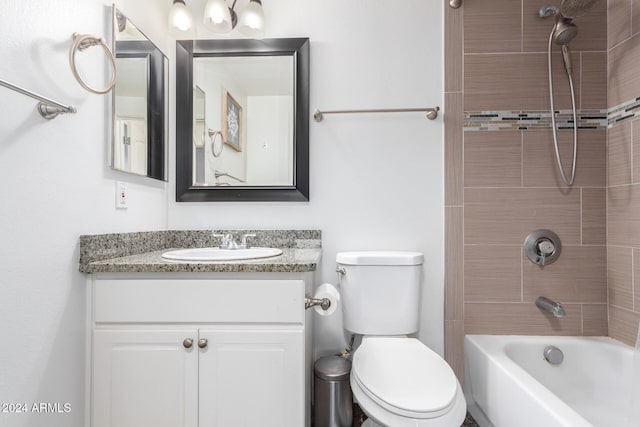 full bathroom featuring vanity, toilet, and tiled shower / bath combo