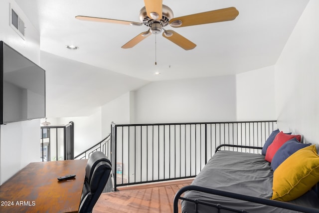 interior space with hardwood / wood-style floors, ceiling fan, and lofted ceiling