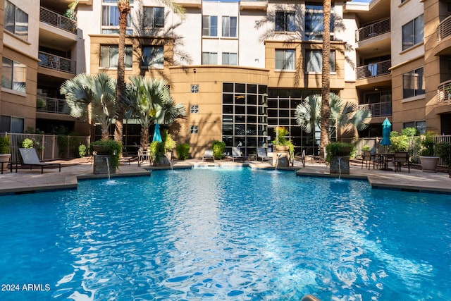 view of swimming pool featuring pool water feature