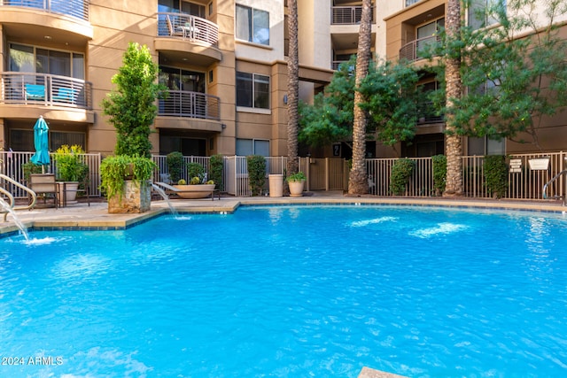 view of pool with pool water feature