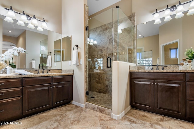 bathroom with vanity and an enclosed shower