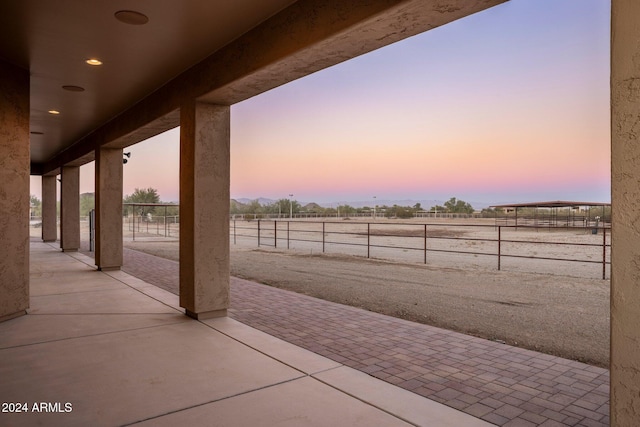 view of patio terrace at dusk