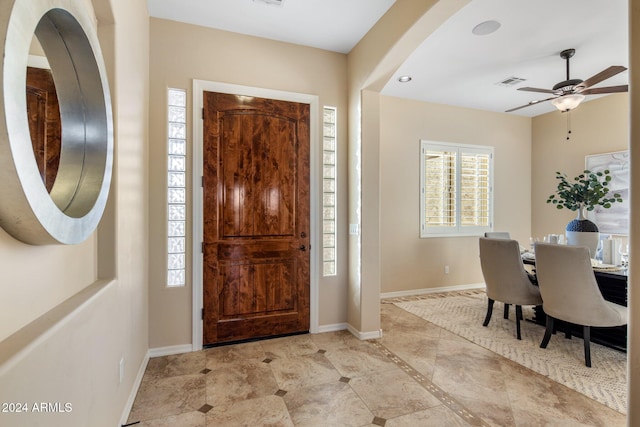 entrance foyer featuring ceiling fan