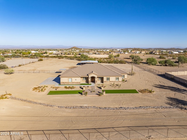 birds eye view of property featuring a mountain view