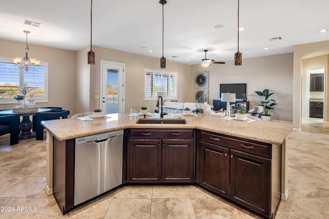 kitchen featuring decorative light fixtures, stainless steel dishwasher, sink, and dark brown cabinets