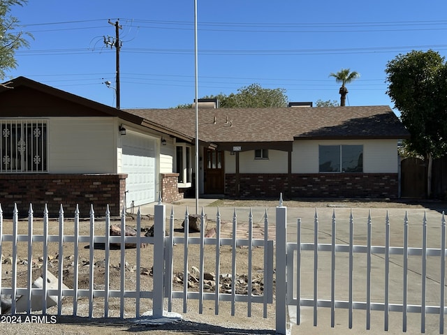 single story home featuring a garage