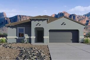 view of front of property with a garage, driveway, and stucco siding