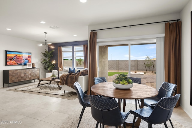 dining room with recessed lighting and light tile patterned floors