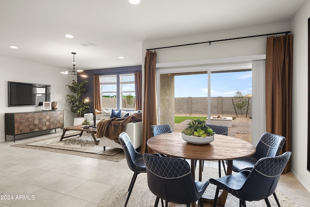 dining space featuring recessed lighting, a chandelier, and light tile patterned flooring