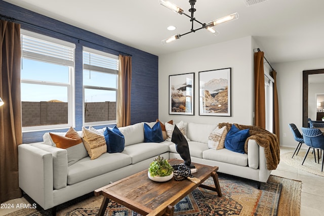 living area featuring a chandelier, wallpapered walls, and light tile patterned floors